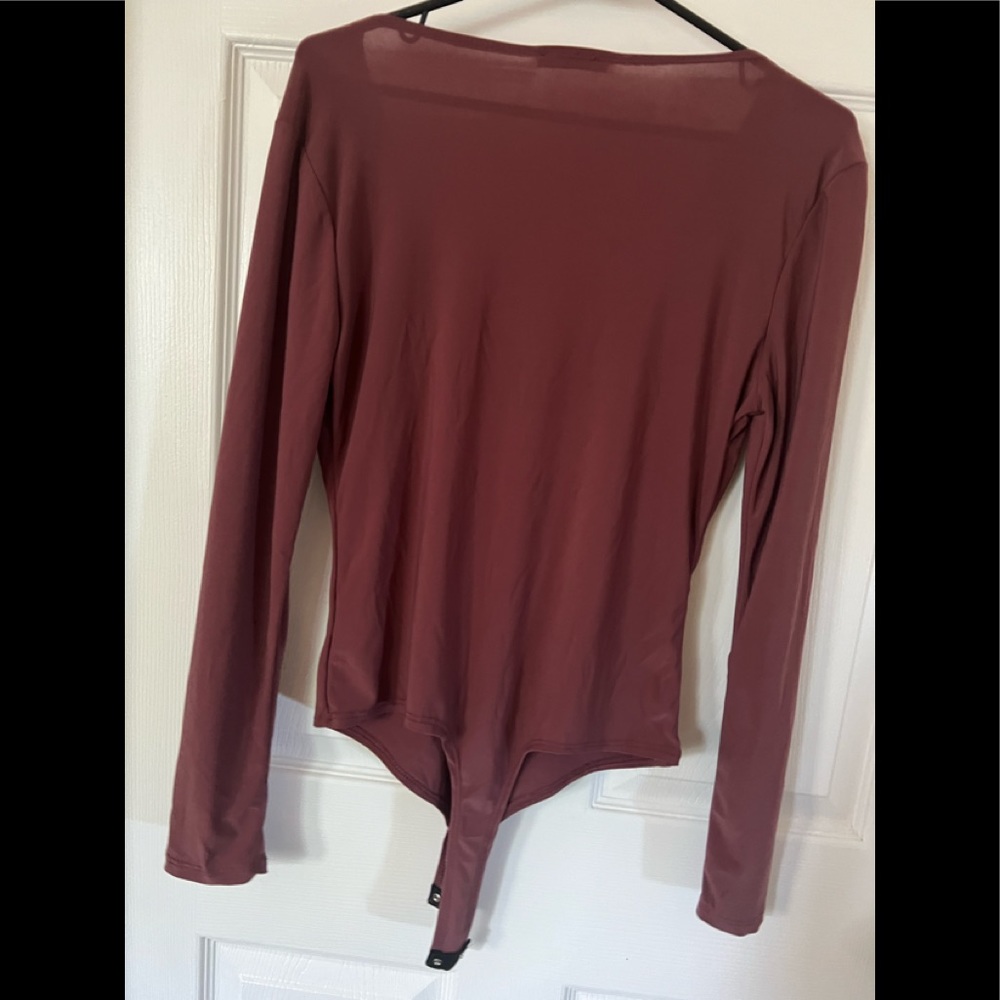 Women’s large never used bodysuit long sleeve
